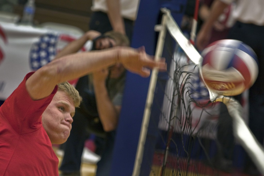 0420-1007-3011-4011_man_spiking_a_volleyball_over_the_net_o